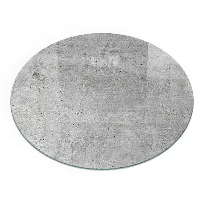Kulatá podložka před krb ze surového betonu v minimalistickém stylu