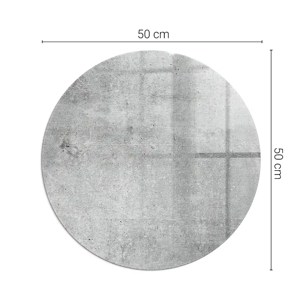 Kulatá podložka před krb ze surového betonu v minimalistickém stylu