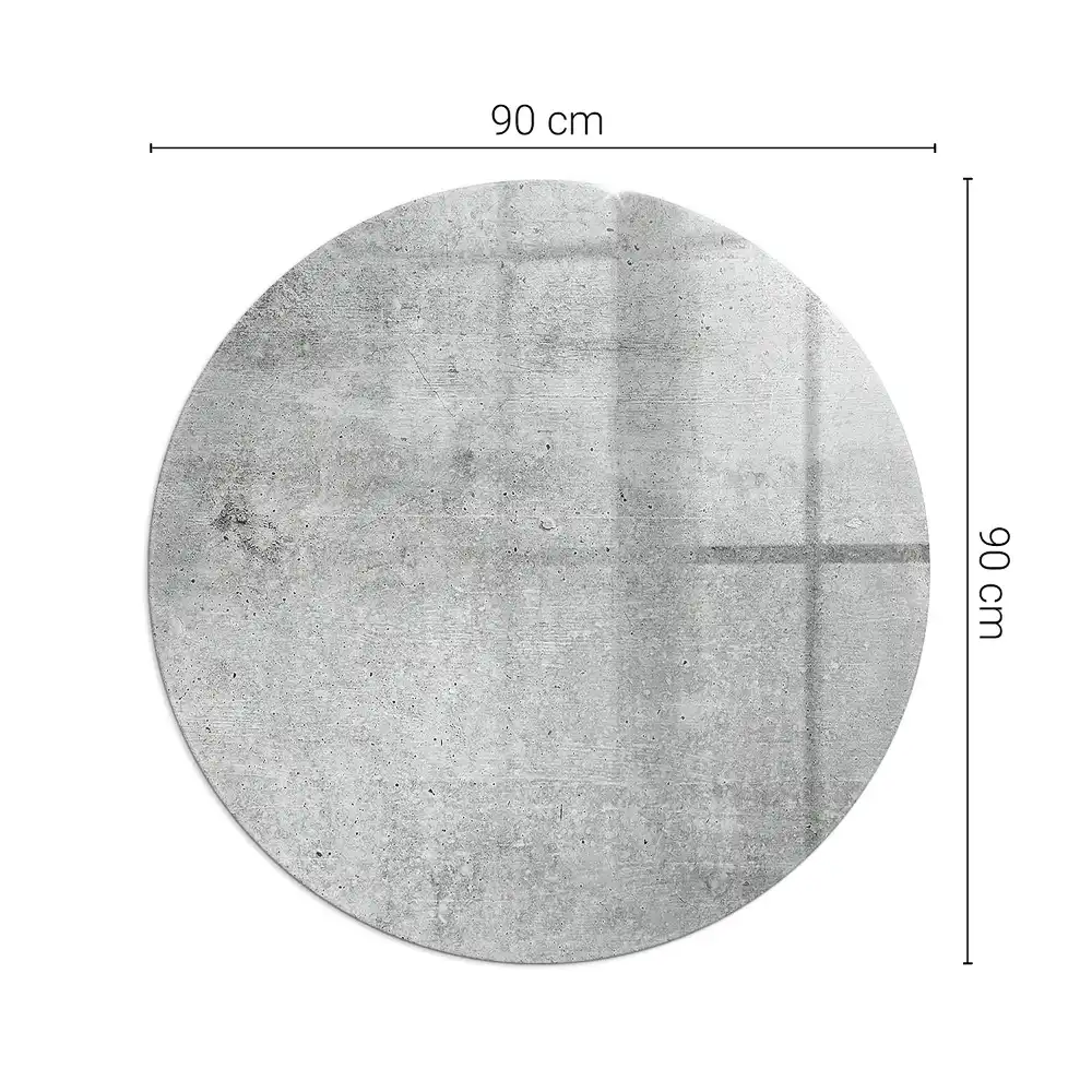 Kulatá podložka před krb ze surového betonu v minimalistickém stylu