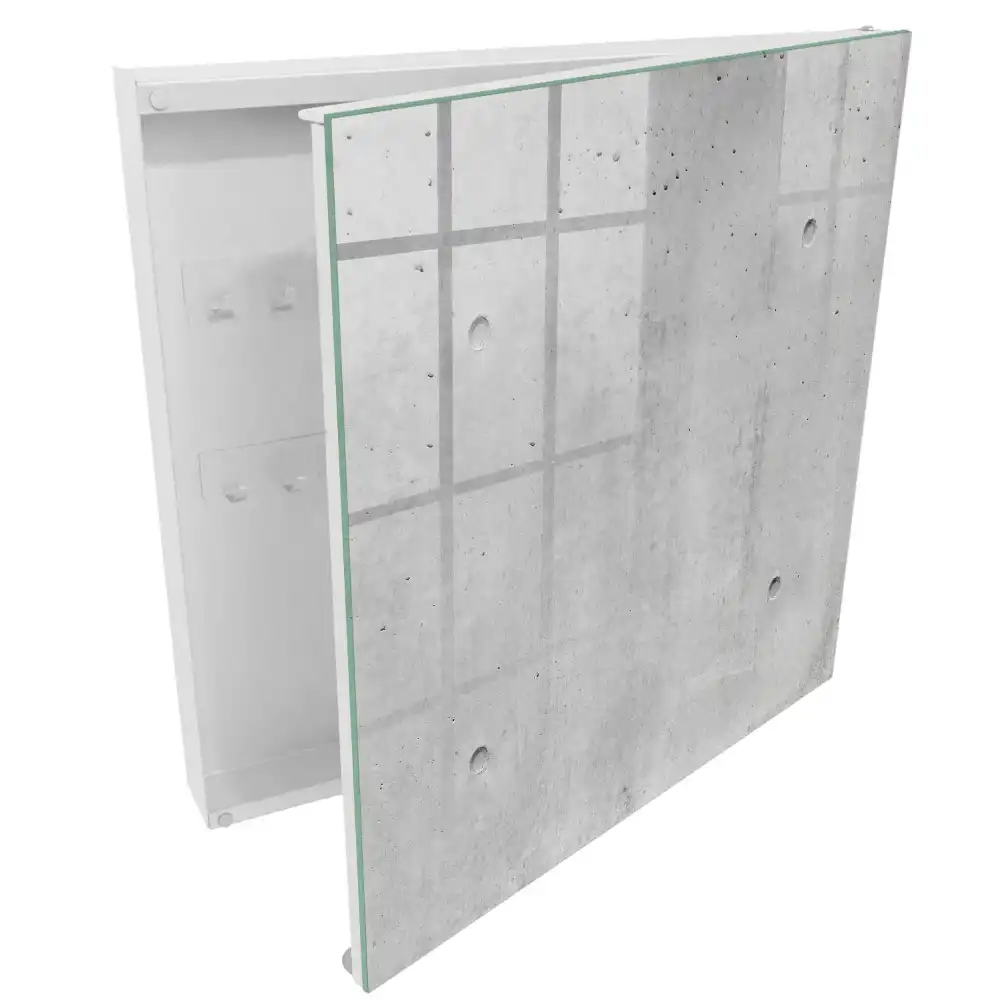 Nástěnná skříňka na klíče v minimalistickém designu se vzhledem surového betonu v šedých odstínech