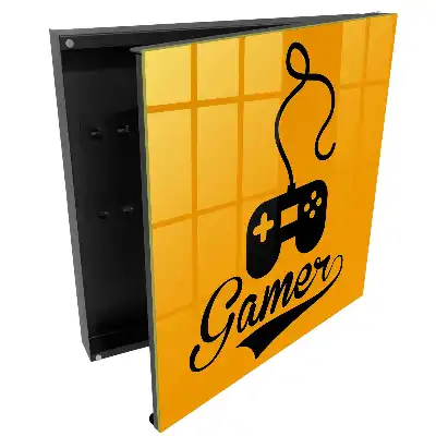 Černý box na klíče s motivem ovladače na oranžovém pozadí
